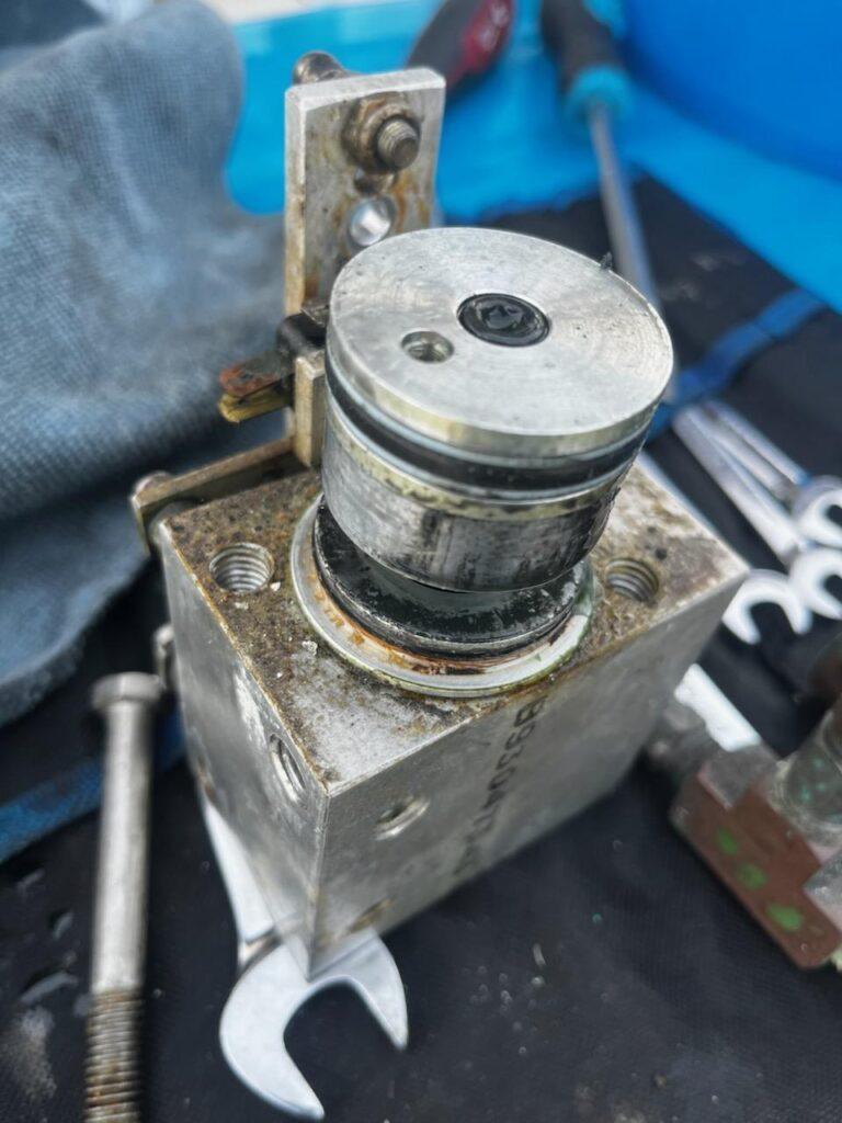 Close-up premium getting ready to rebuild Hynautic hydraulic sender piston and internal sealing surfaces by 805 Marine Diesel Mechanic