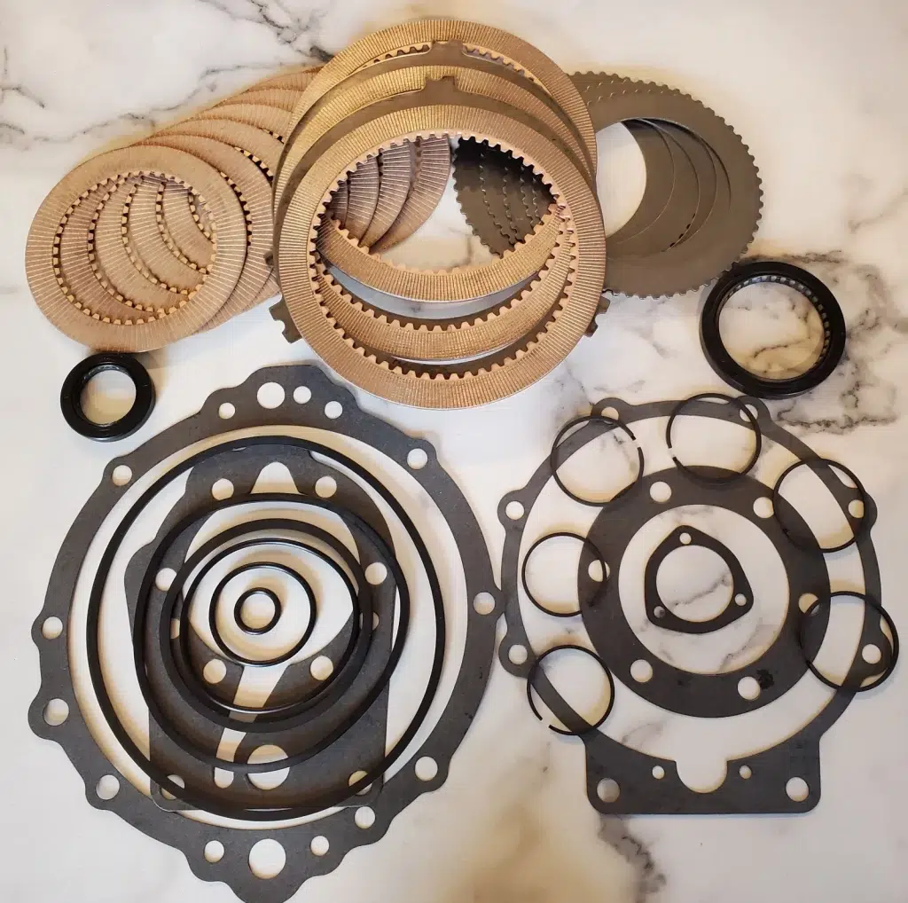 Complete Borg Warner Velvet Drive rebuild kit — friction plates, steels, seals, and gaskets used during our professional rebuilds.
