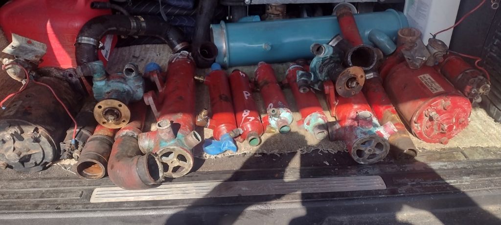 Ford Lehman 120 cooling system components removed and ready to be descaled