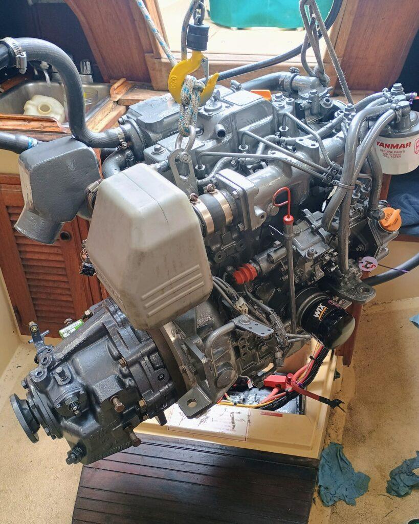 Yanmar 3JH4E lifted for Borg Warner Velvet Drive removal and marine diesel service in Ventura California
