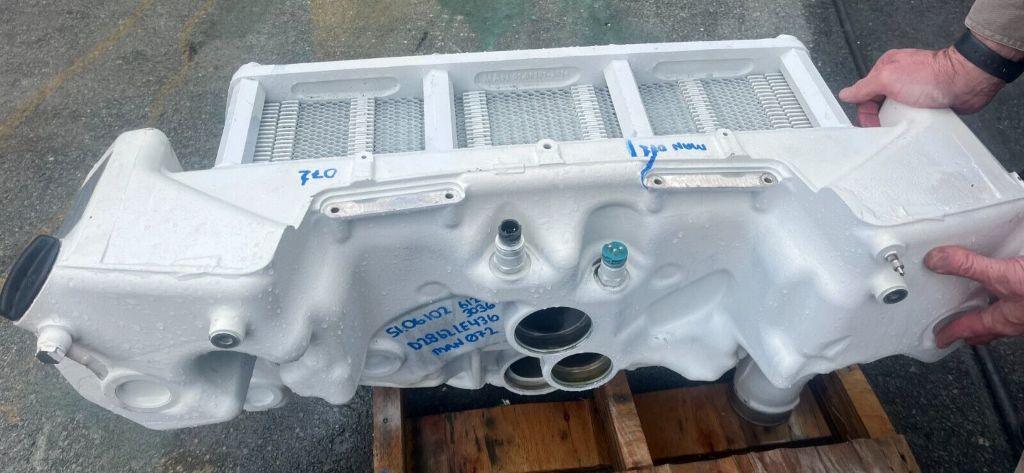 MAN marine diesel engine heat exchanger removed for cleaning and cooling system service in Southern California