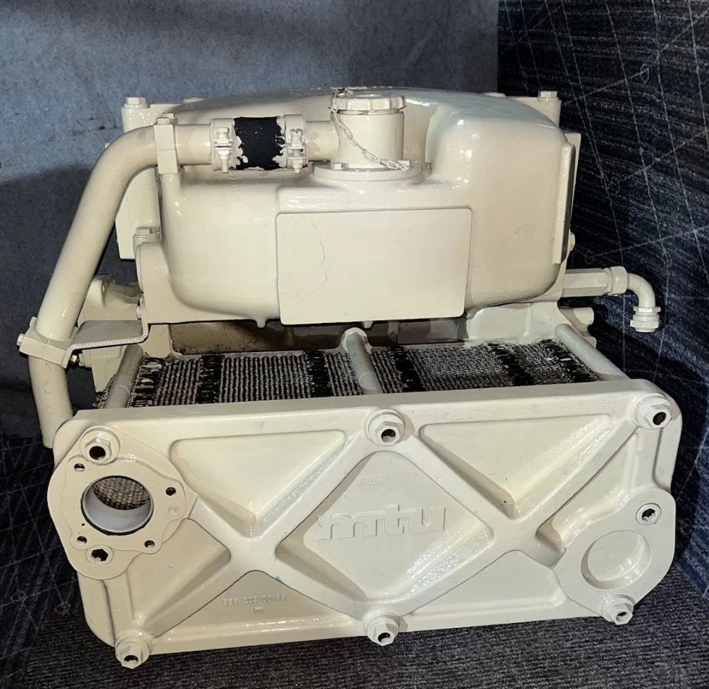 MTU marine diesel engine heat exchanger removed for cleaning and cooling system service in Southern California