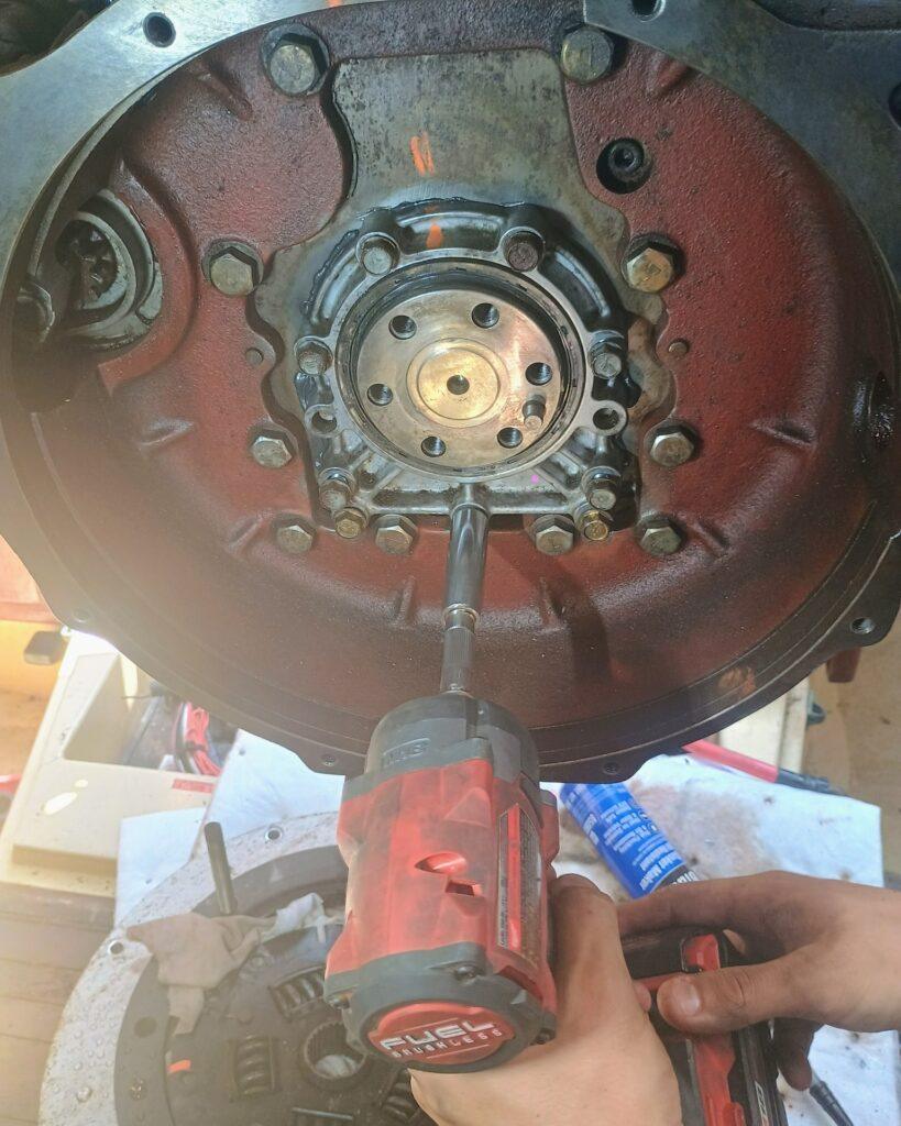 Replacing the rear main seal on a Yanmar 3JH4E marine diesel engine using proper torque and alignment techniques