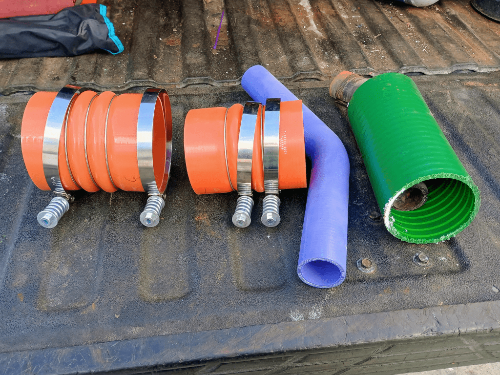 High temperature silicone marine wet exhaust hoses and Torque Compression hose clamps prepared for Detroit Diesel 8V53T exhaust installation