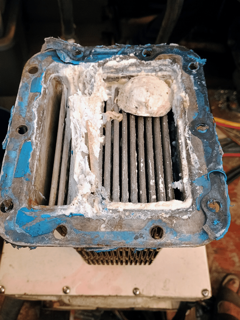 Marine diesel cooling system diagnosis showing clogged heat exchanger core inspected by trained technician at 805 Marine Diesel Mechanic Ventura Channel Islands Harbor