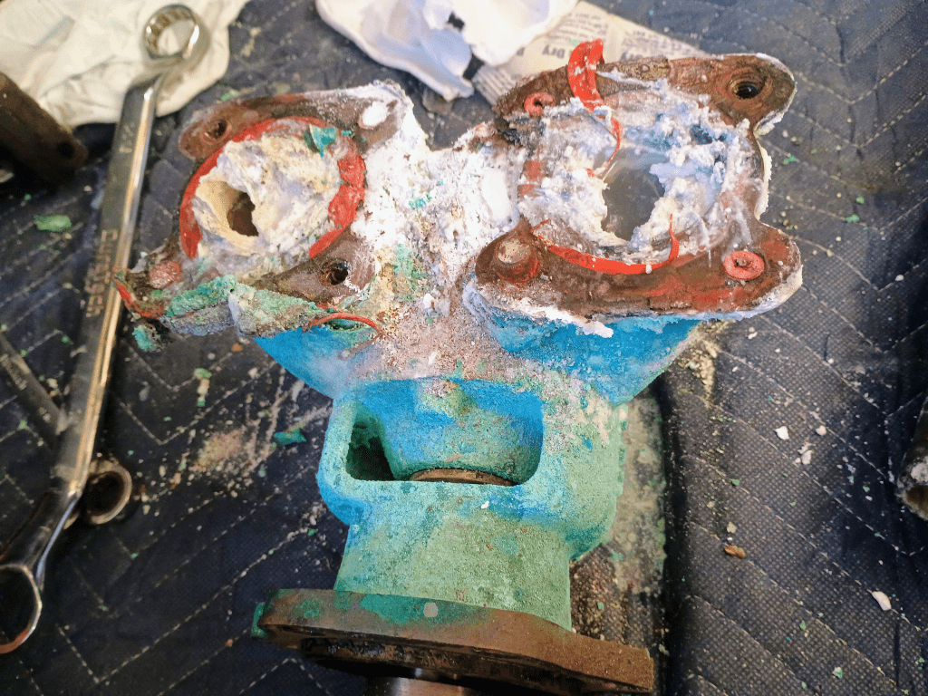 Corroded Caterpillar marine diesel seawater pump housing showing severe salt corrosion and cooling system failure diagnosed by 805 Marine Diesel Mechanic Ventura Channel Islands Harbor
