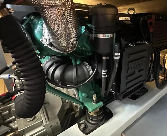 Clean and well maintained engine room aboard 44 foot Beneteau trawling yacht during Volvo Penta D4 marine engine survey