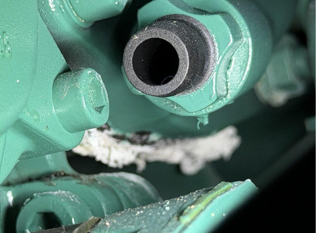 Scaled Volvo Penta D4 heat exchanger and aftercooler core showing need for seawater cooling system service and descaling