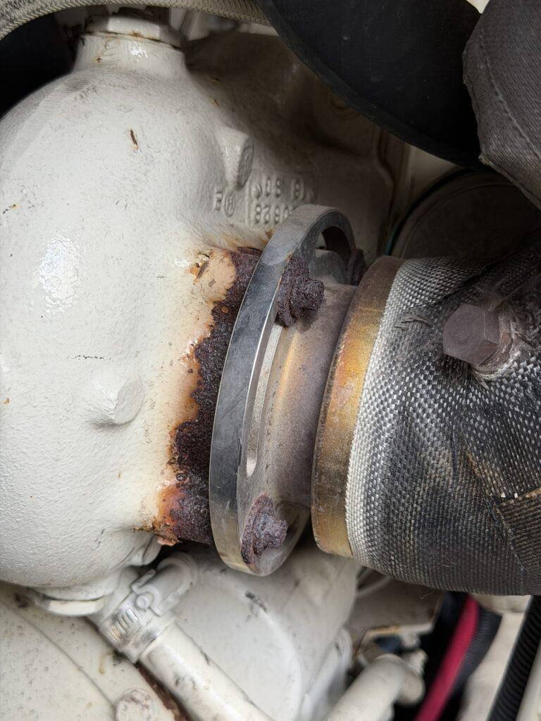 Port Cummins 6BTA5.9 M3 turbocharger leaking oil from shaft seals requiring replacement during Luhrs 34 marine engine survey