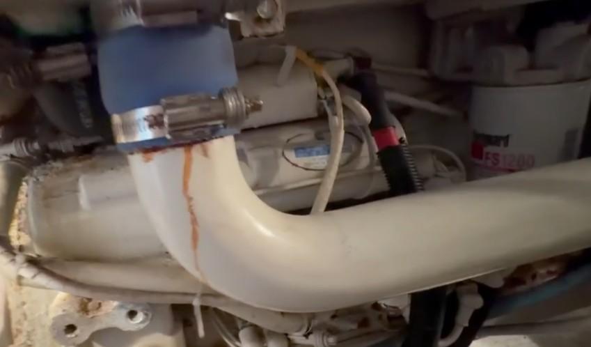 Small coolant leak at port Cummins 6BTA5.9 M3 Diamond Series heat exchanger hose connection discovered during Ocean Alexander 42 marine engine survey