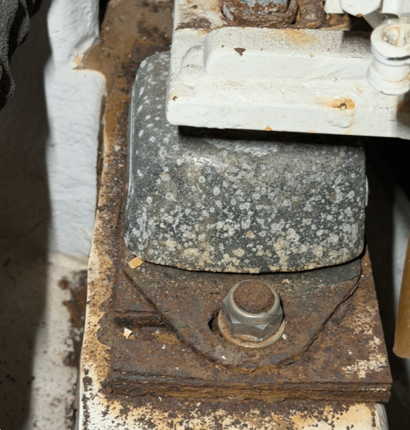 Saltwater-damaged front motor mount on port MAN D2848LE401 marine diesel engine requiring replacement